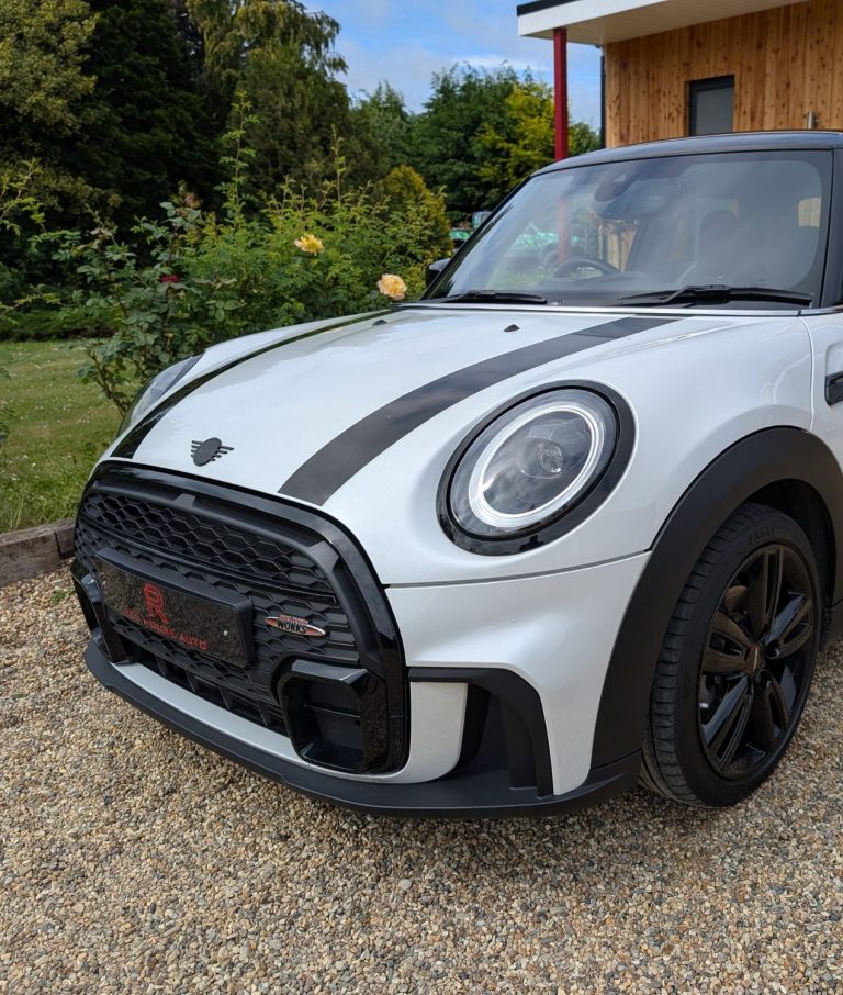 A white Mini Cooper
